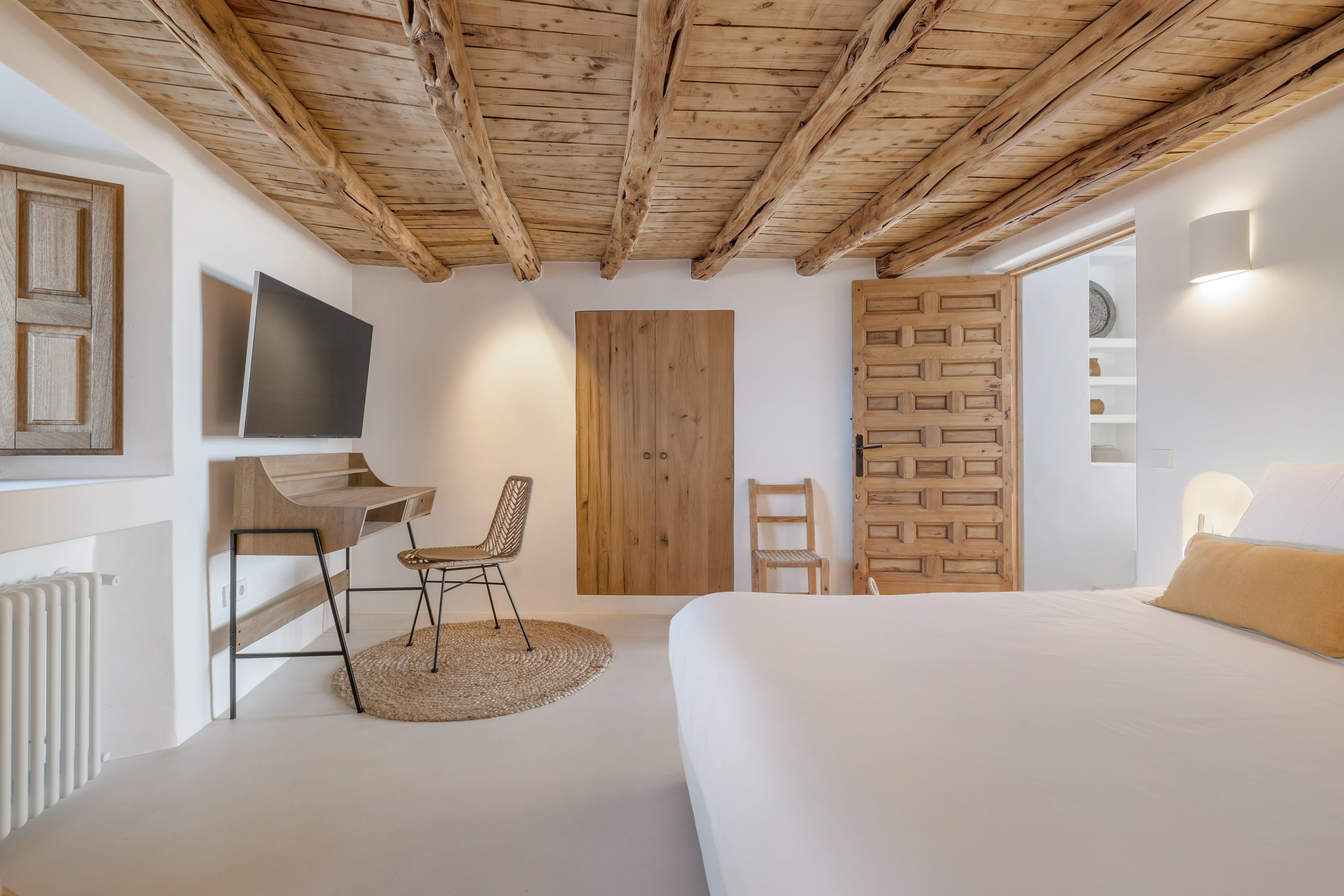 Bedroom with Wooden Elements and Smart TV