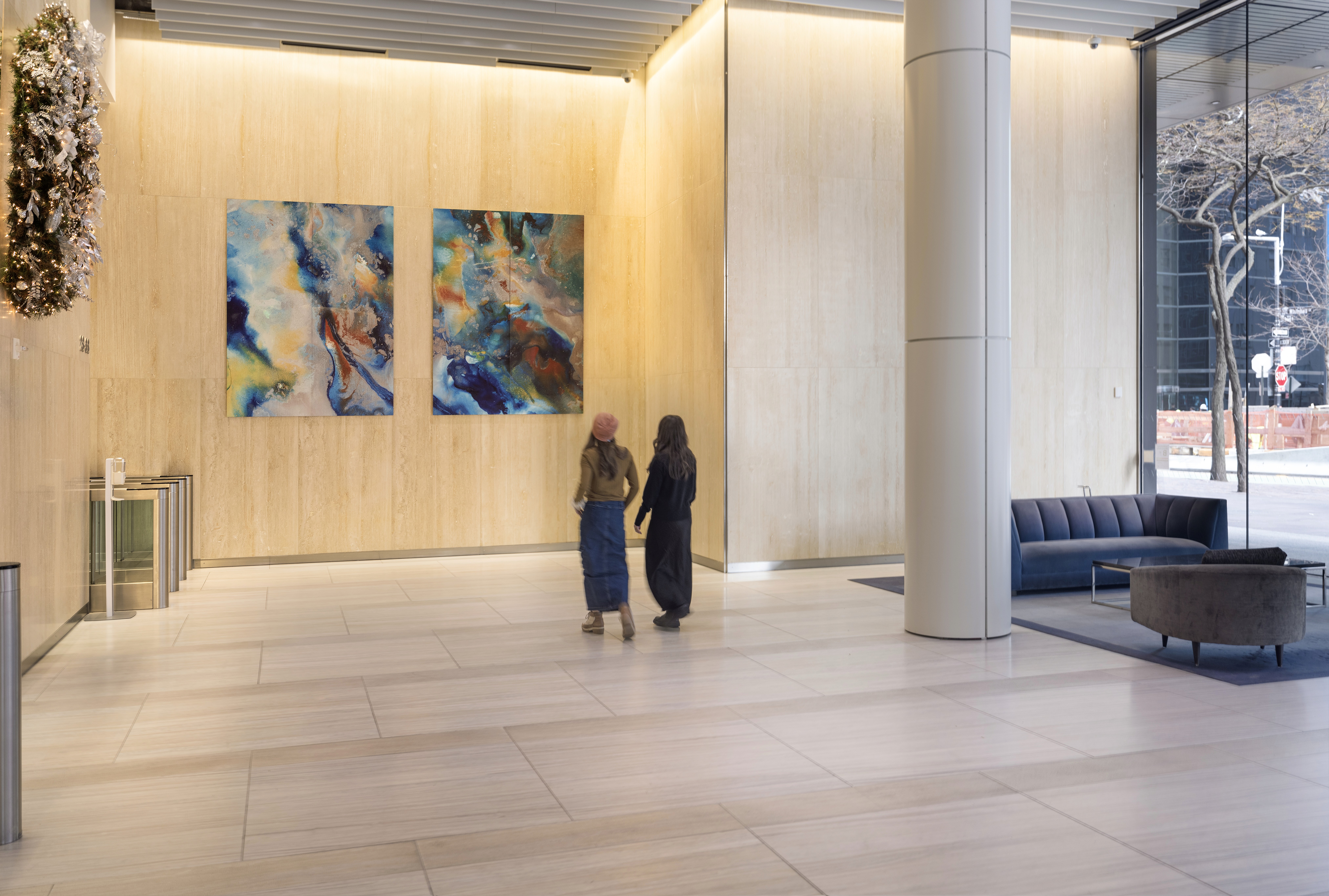 Visitors observing an abstract painting in a modern art gallery