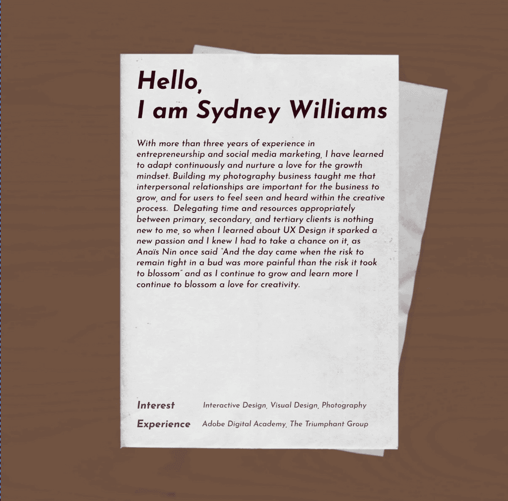 A stack of blank papers and four instant photos, one showing a woman with curly hair smiling, on a wooden surface.