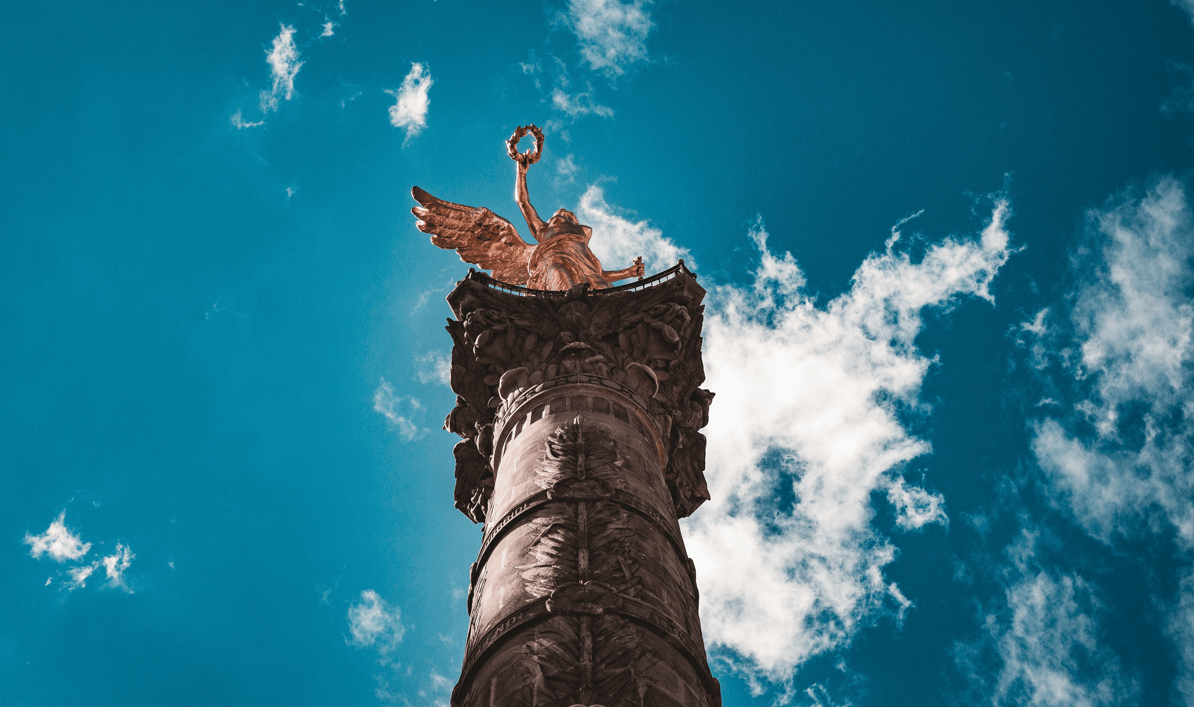 golden statue on tower