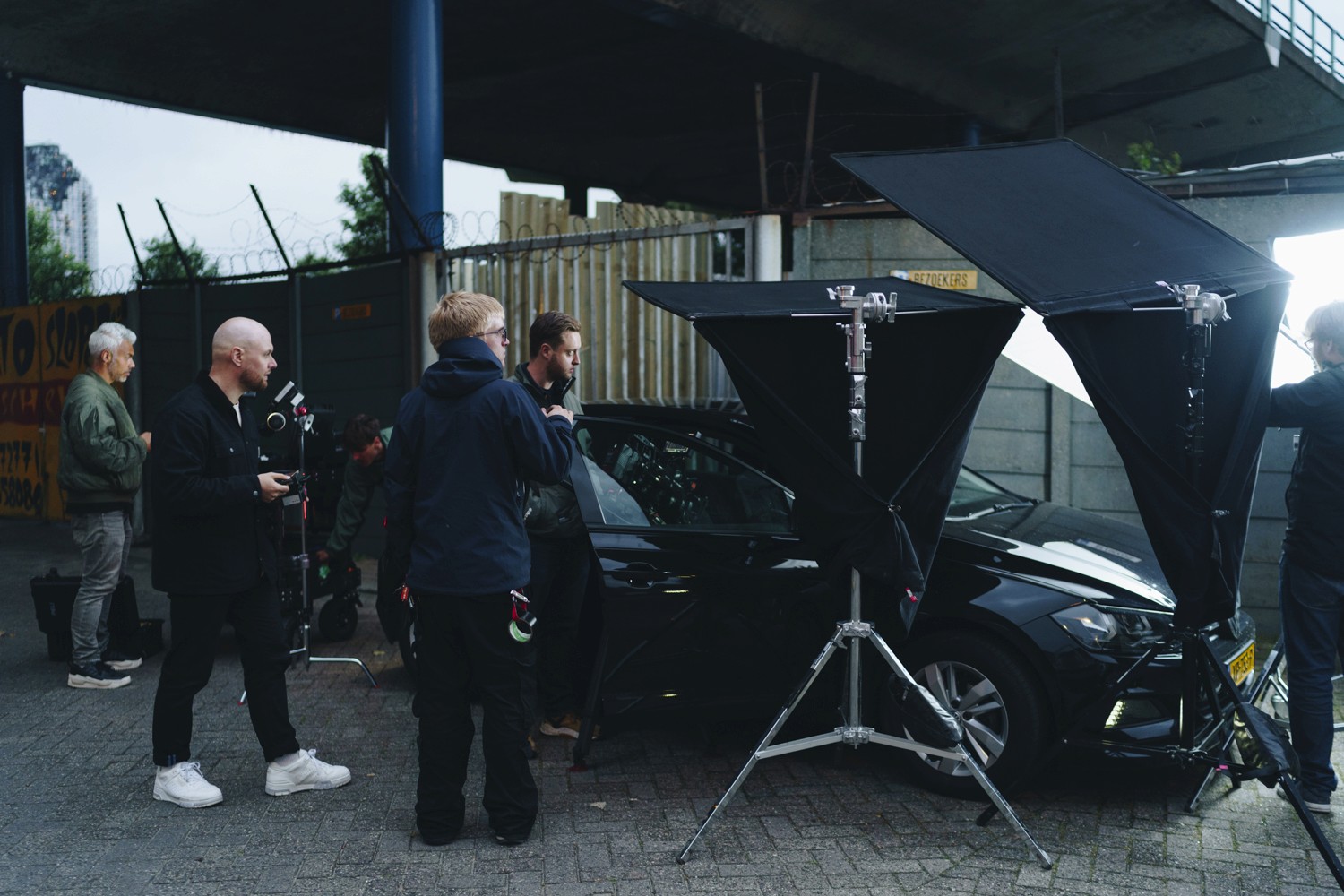 The image captures the ethereal beauty of an underwater cave illuminated by sunbeams penetrating through an opening above.