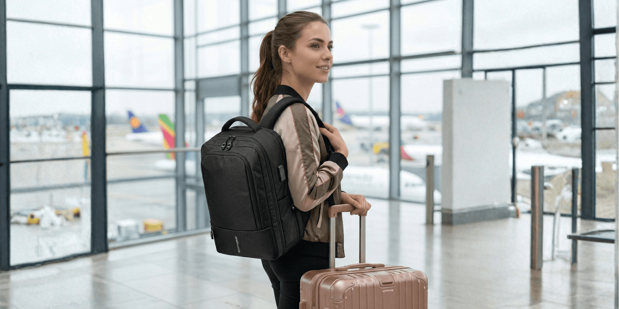 Woman with backpack and carry-on suitcase standing in airport terminal, ready for travel.