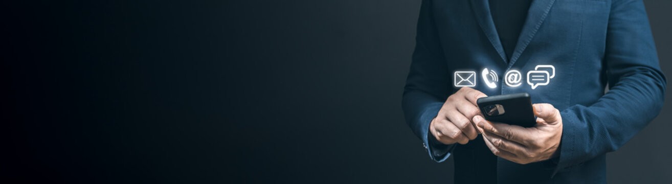 black and brown rotary phone near gray wall