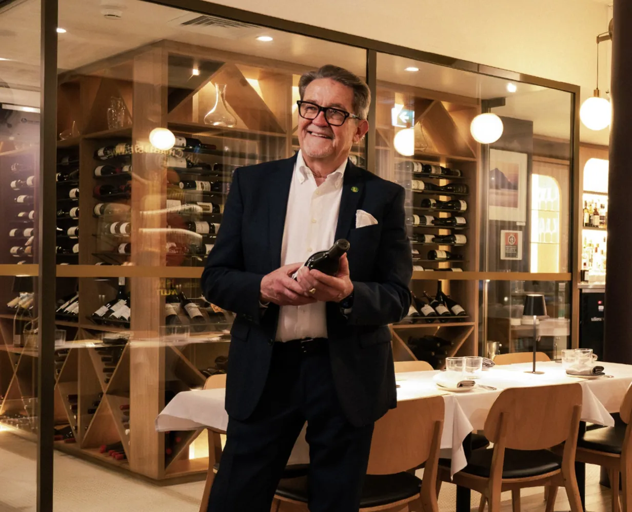 John Bligh, Annata's owner and sommelier, in front of the restaurant wine cellar