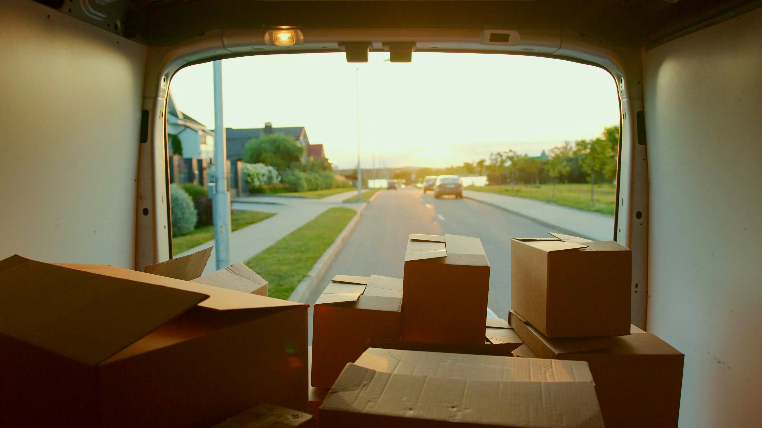 Inside view of a open trunk with boxes.