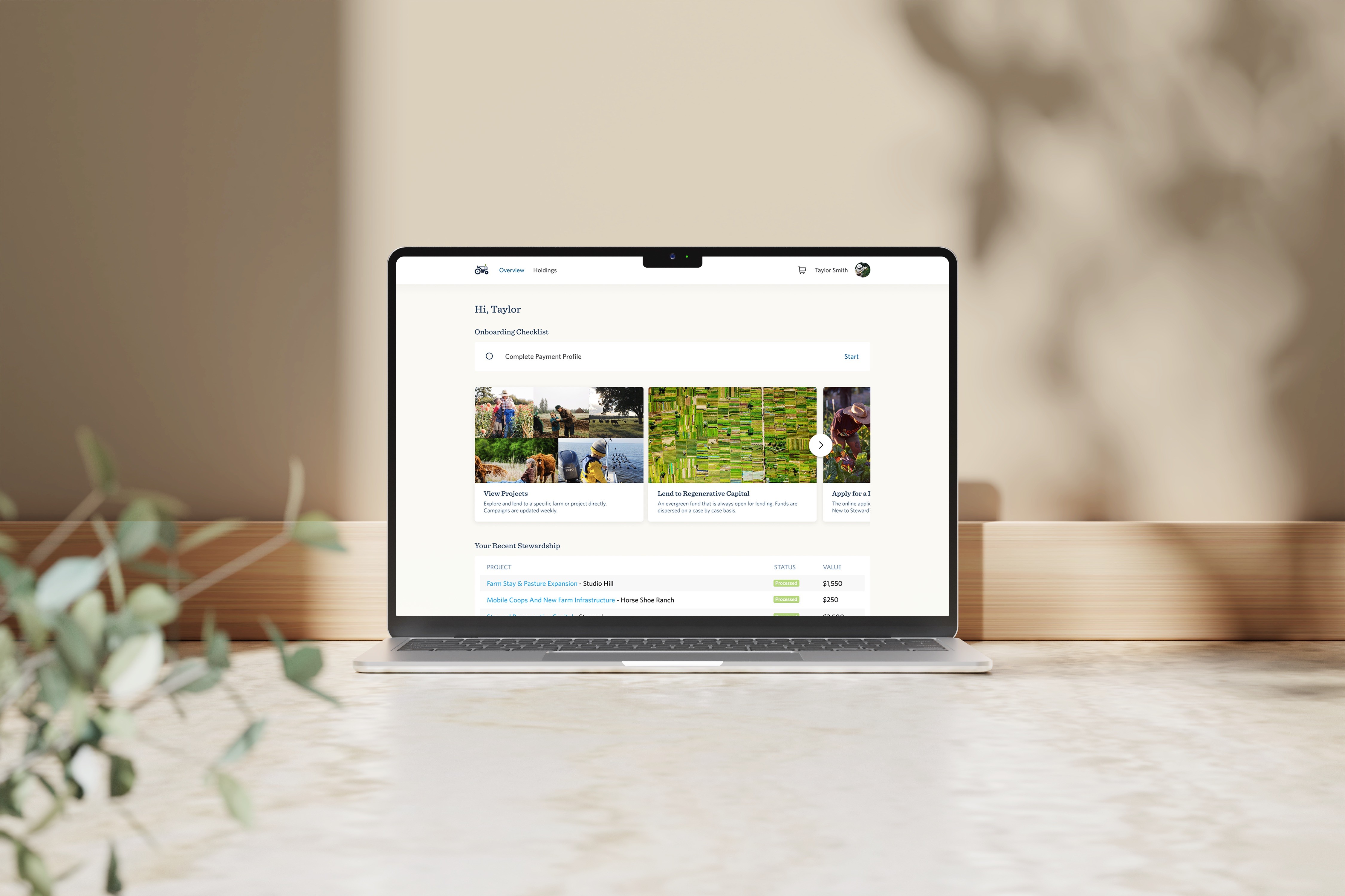 A mockup of a macbook with Steward's lending interface design