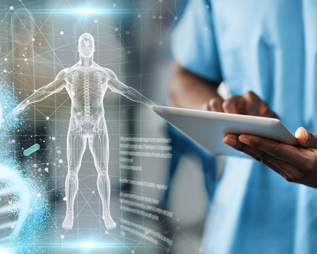 Medical professional using tablet with holographic 3D human anatomy and data overlay, symbolizing advanced digital diagnostics.