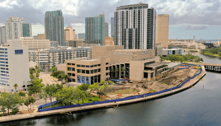Aerial rendering of Straz Center Expansion architecture showing curved modern design along Tampa River with downtown skyline