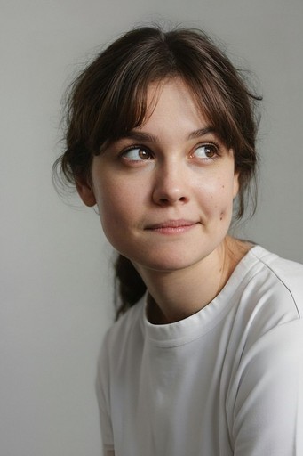 smiling woman wearing white and black pinstriped collared top