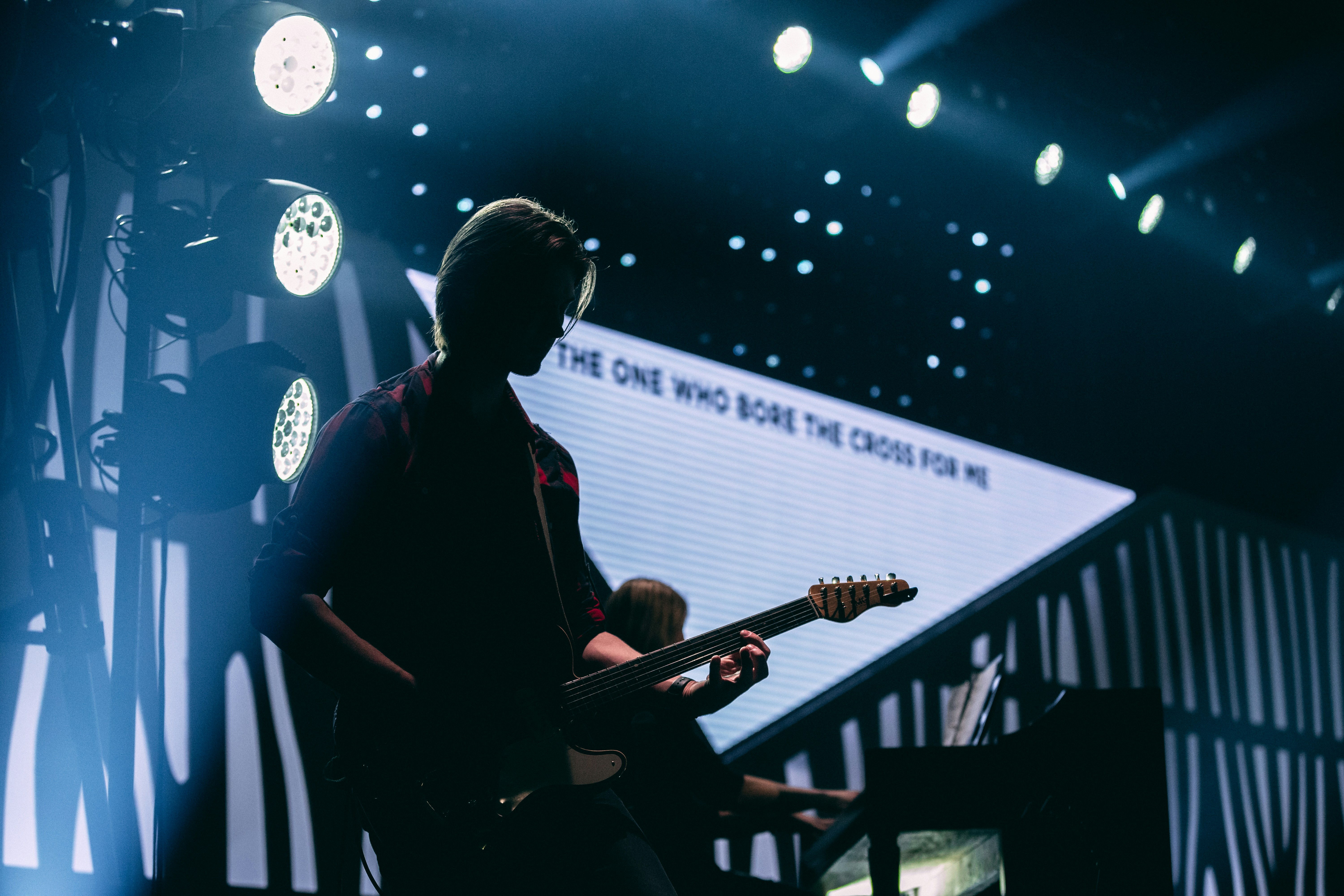 guitarist on stage performing