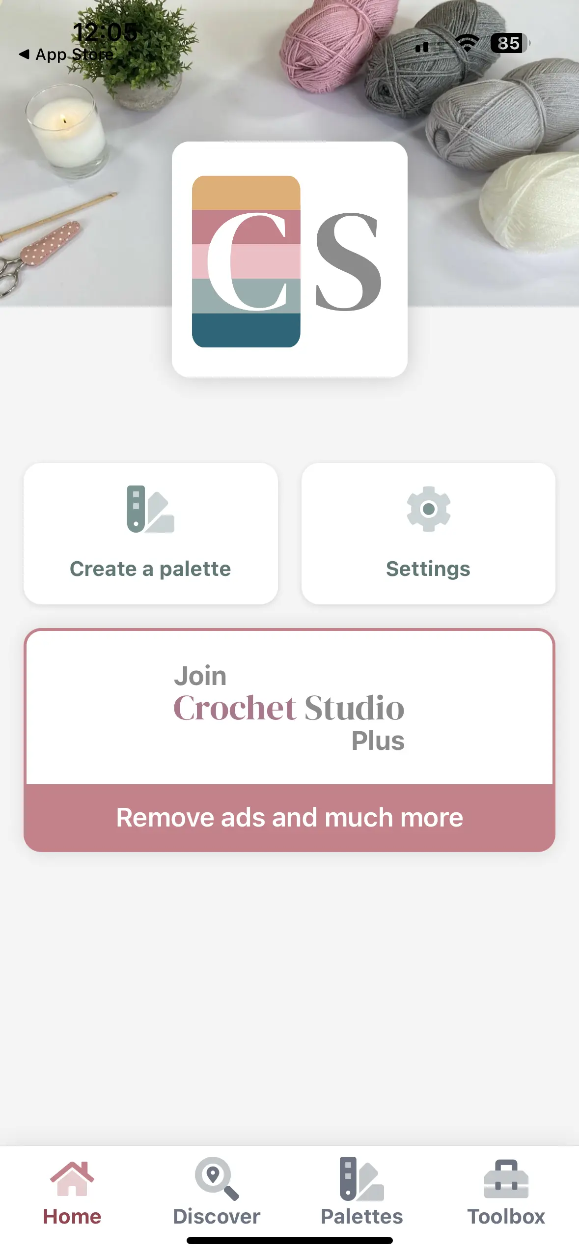 Mobile app screen displaying the Crochet Studio dashboard, featuring a logo at the top, buttons for creating a palette, accessing settings, and a prompt to join Crochet Studio Plus to remove ads.