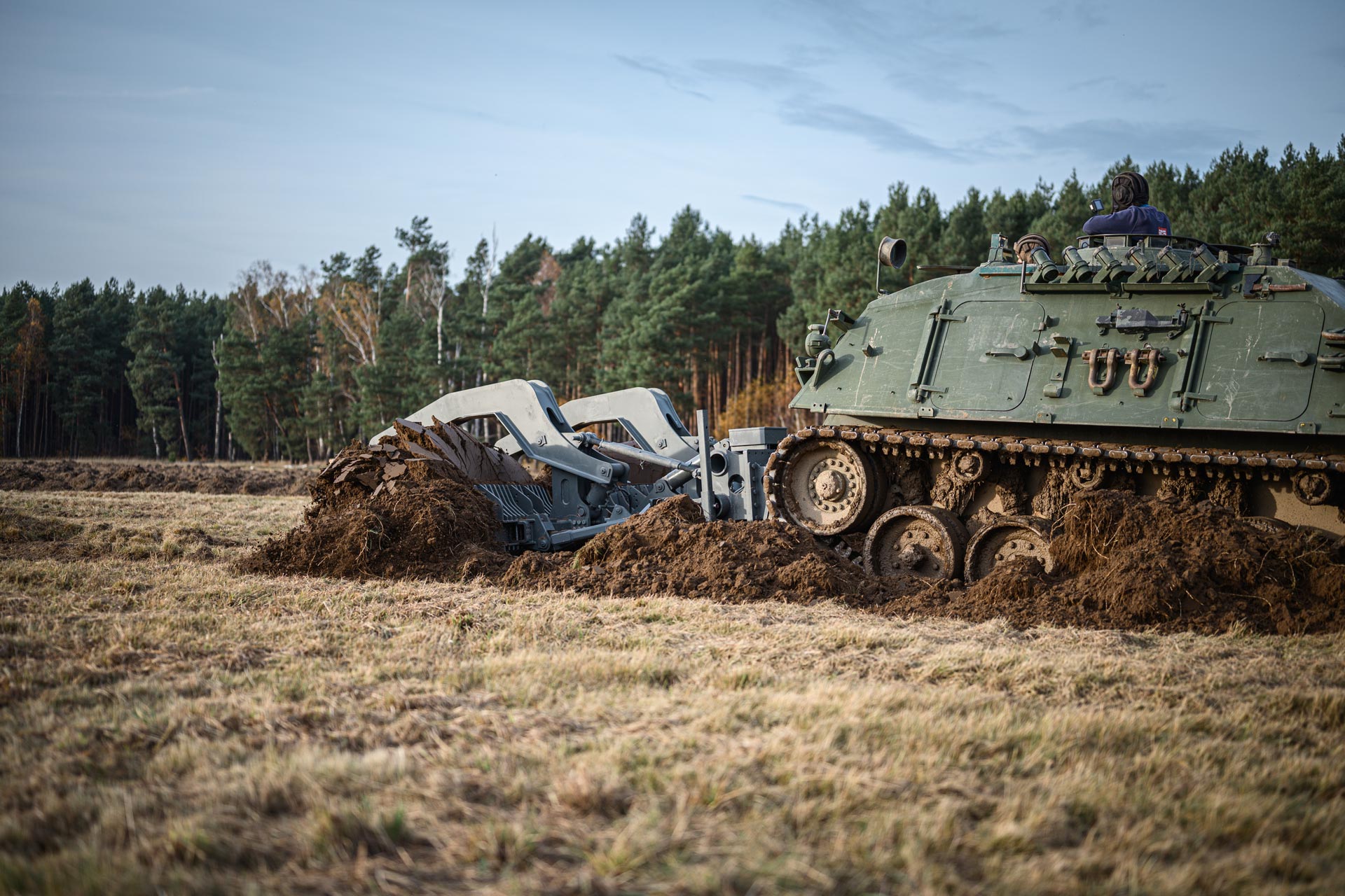 GCS Mine Plough attachment on a tracked armoured vehicle breaching a minefield during breaching operations.
