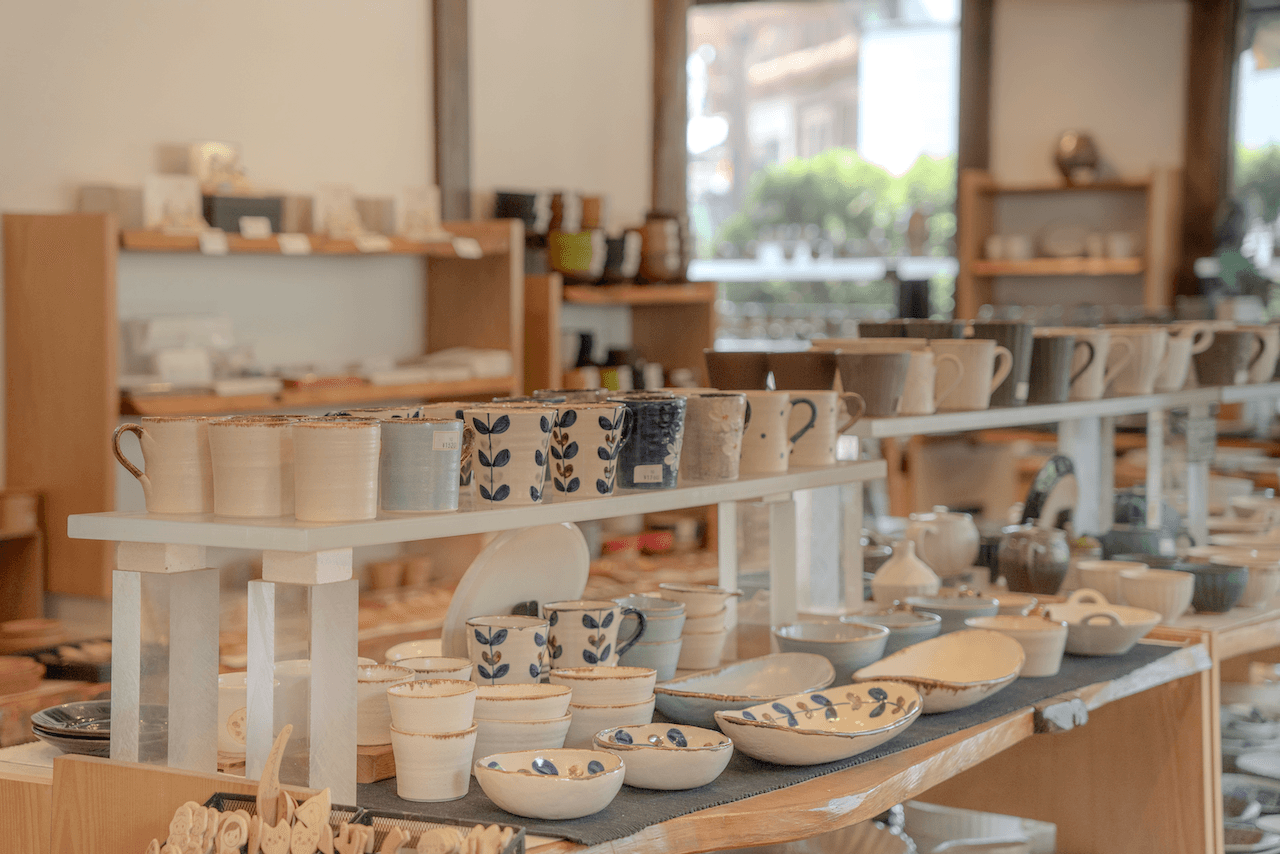 Pottery ware for sale on a display shelf