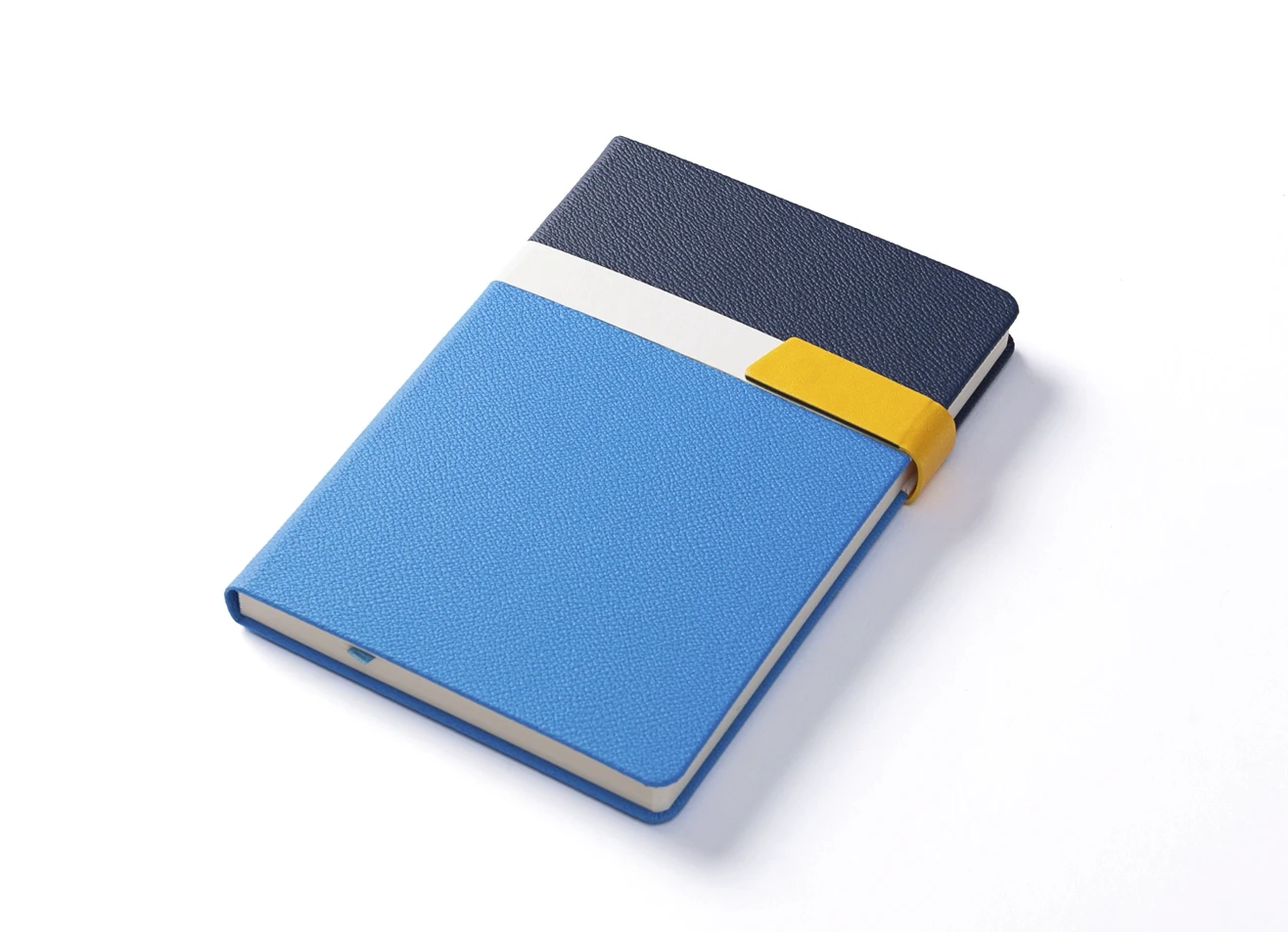 Angled view of blue and white textured notebook with closed strap.