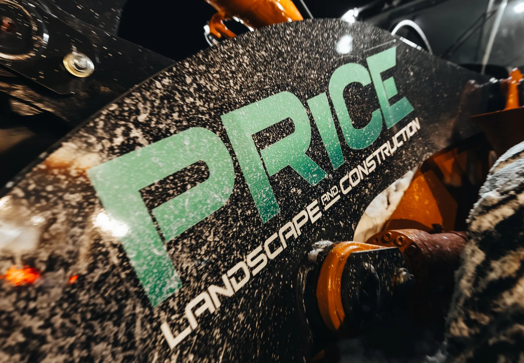 Price Landscape and Construction close up of logo on a loader machine