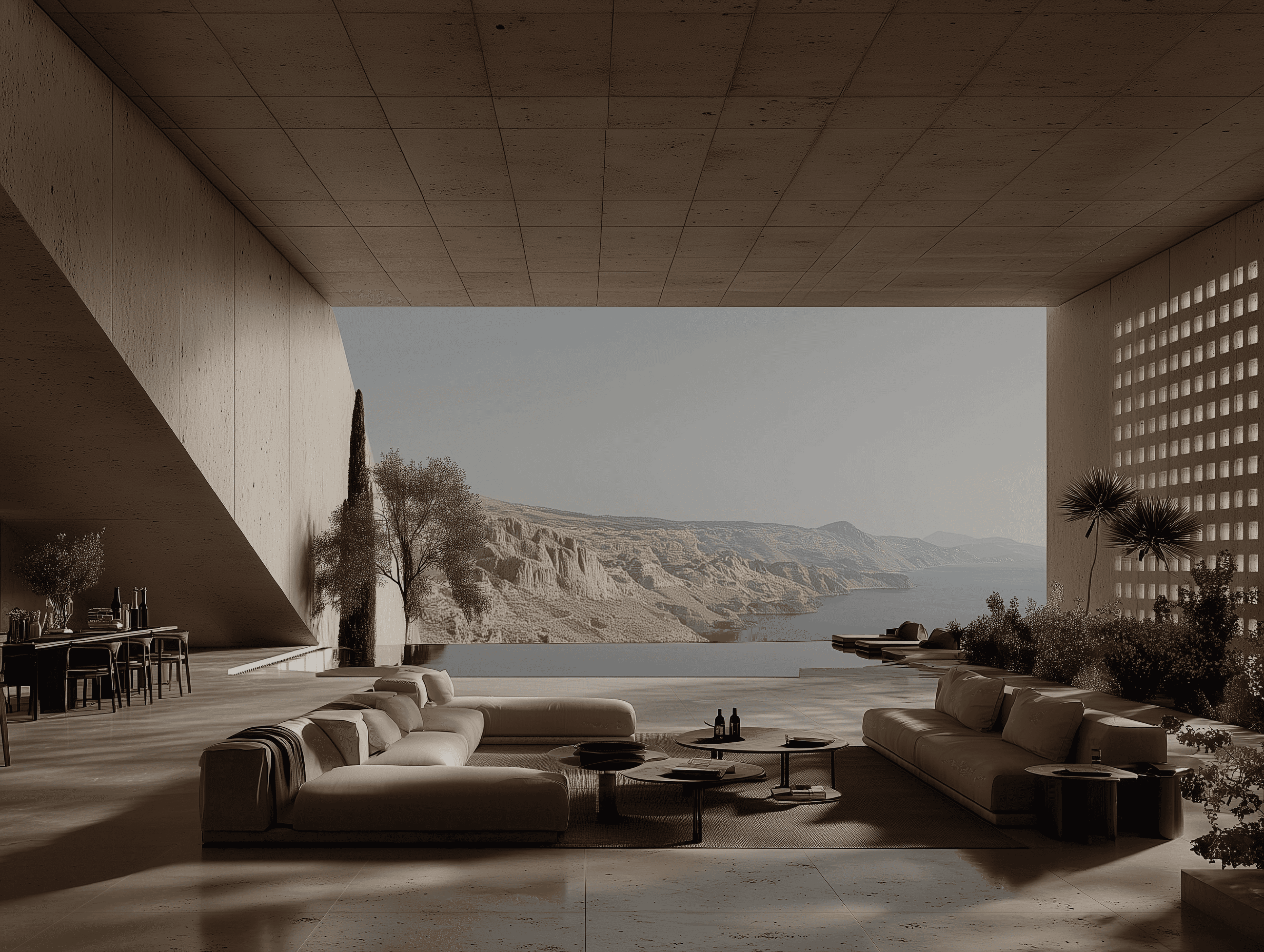A minimalist white living room with modular seating and floor-to-ceiling windows overlooking a vast desert canyon.