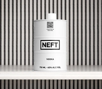 NEFT Vodka barrel on a white shelf with a slatted wall in the background.