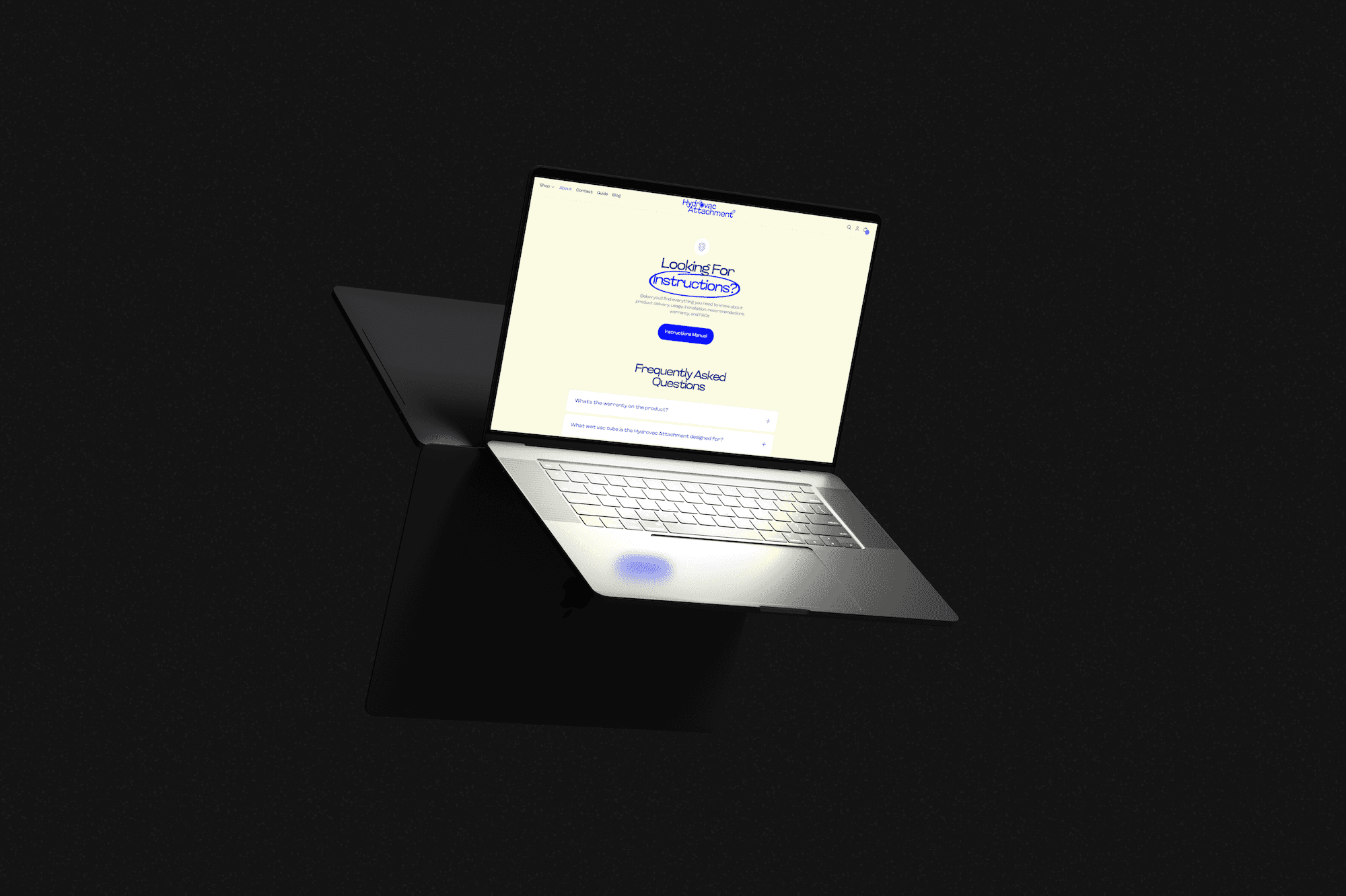 a floating laptop in a dark studio setting showcasing a website
