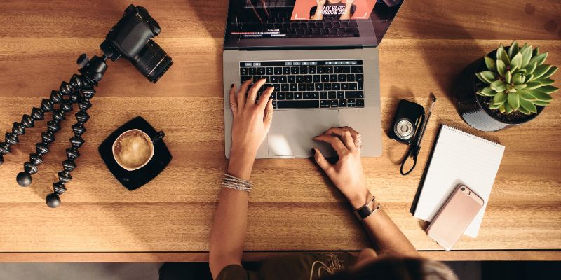 A woman editing a video on her laptop