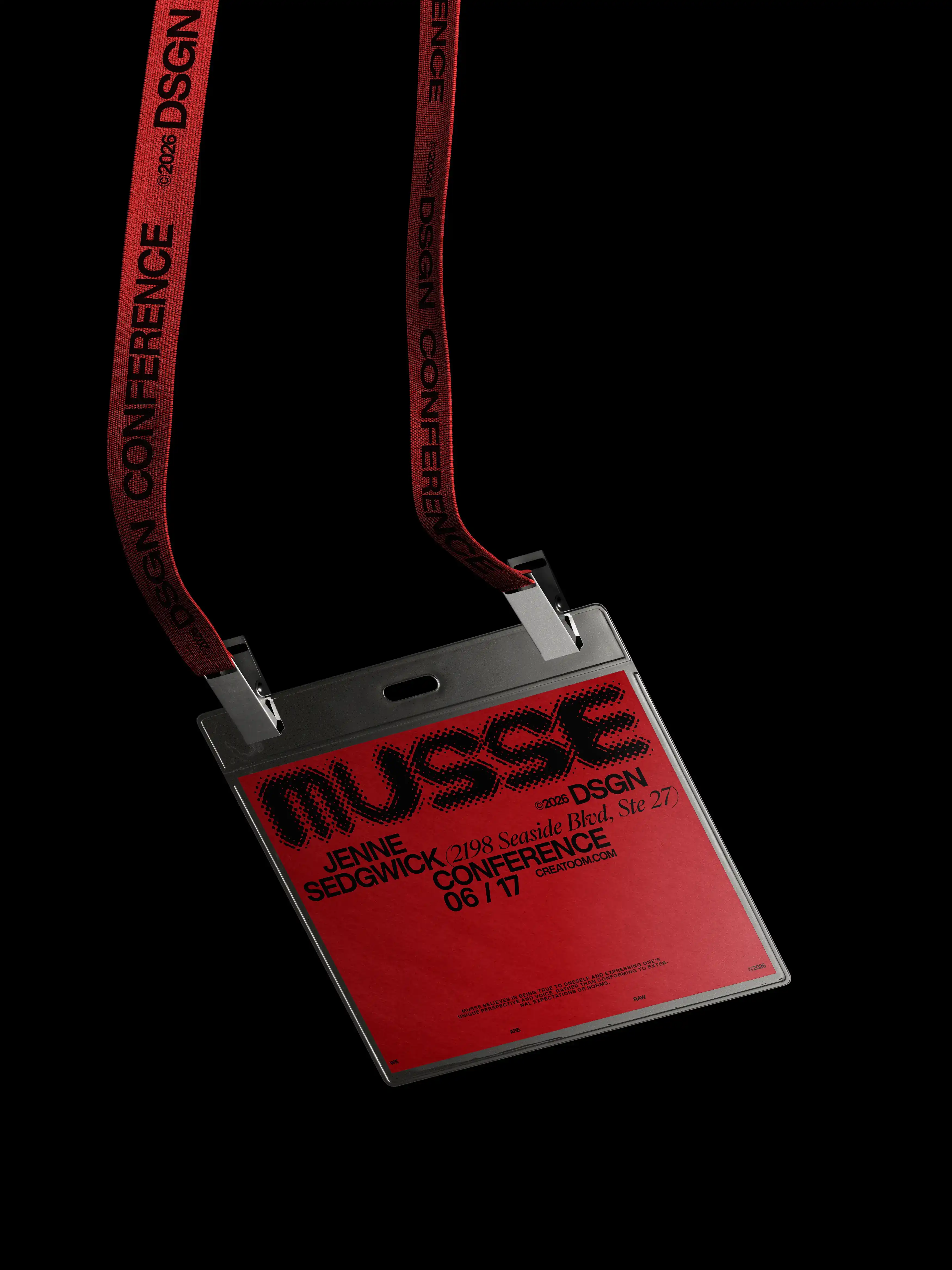Red conference badge with black typography and lanyard