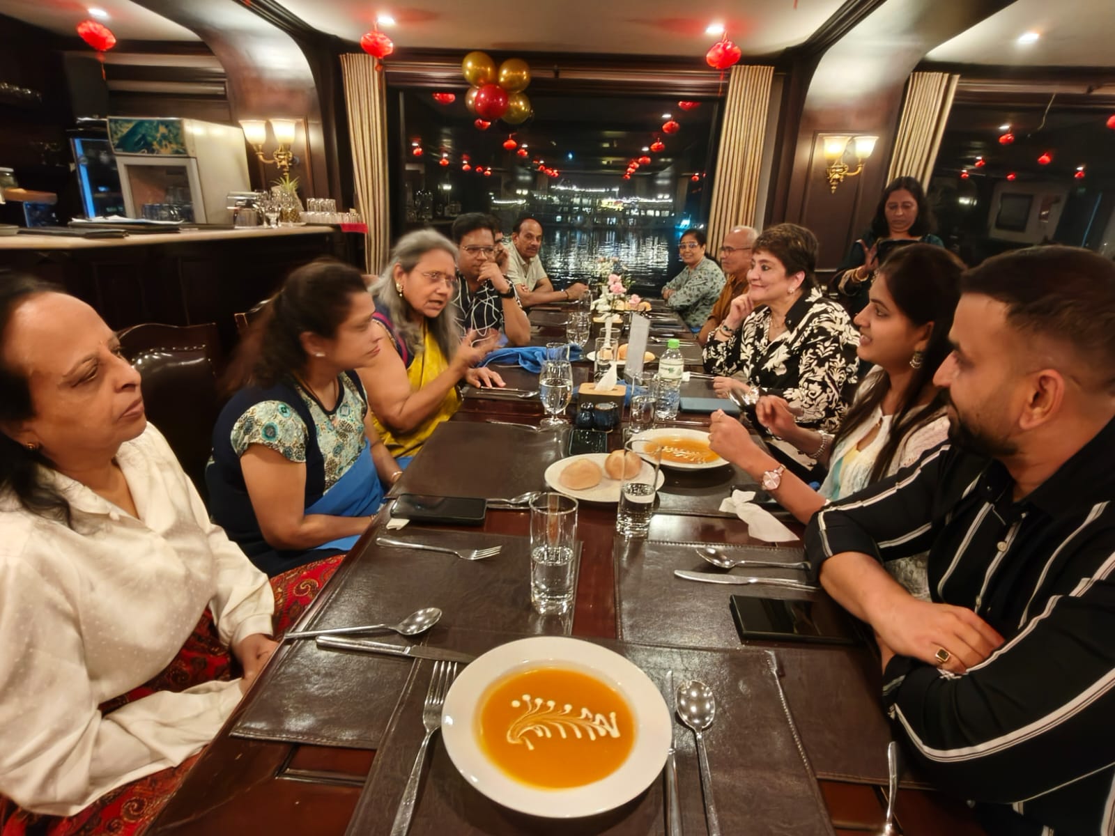 Group of people standing in a grassy field