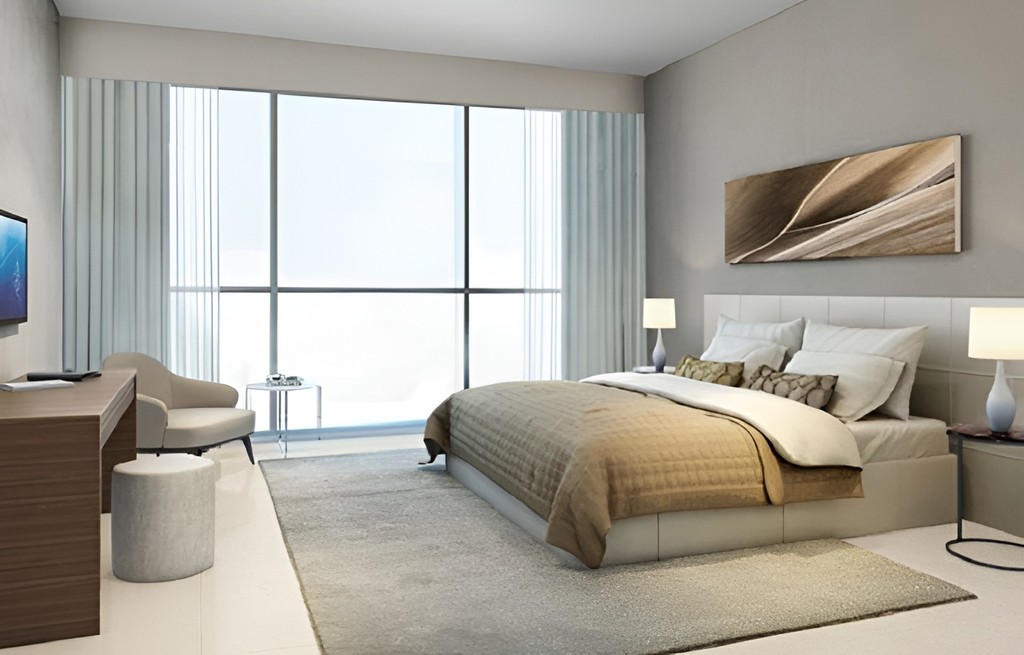 Modern bed room at Dragon Towers featuring white furniture and a flat-screen TV.