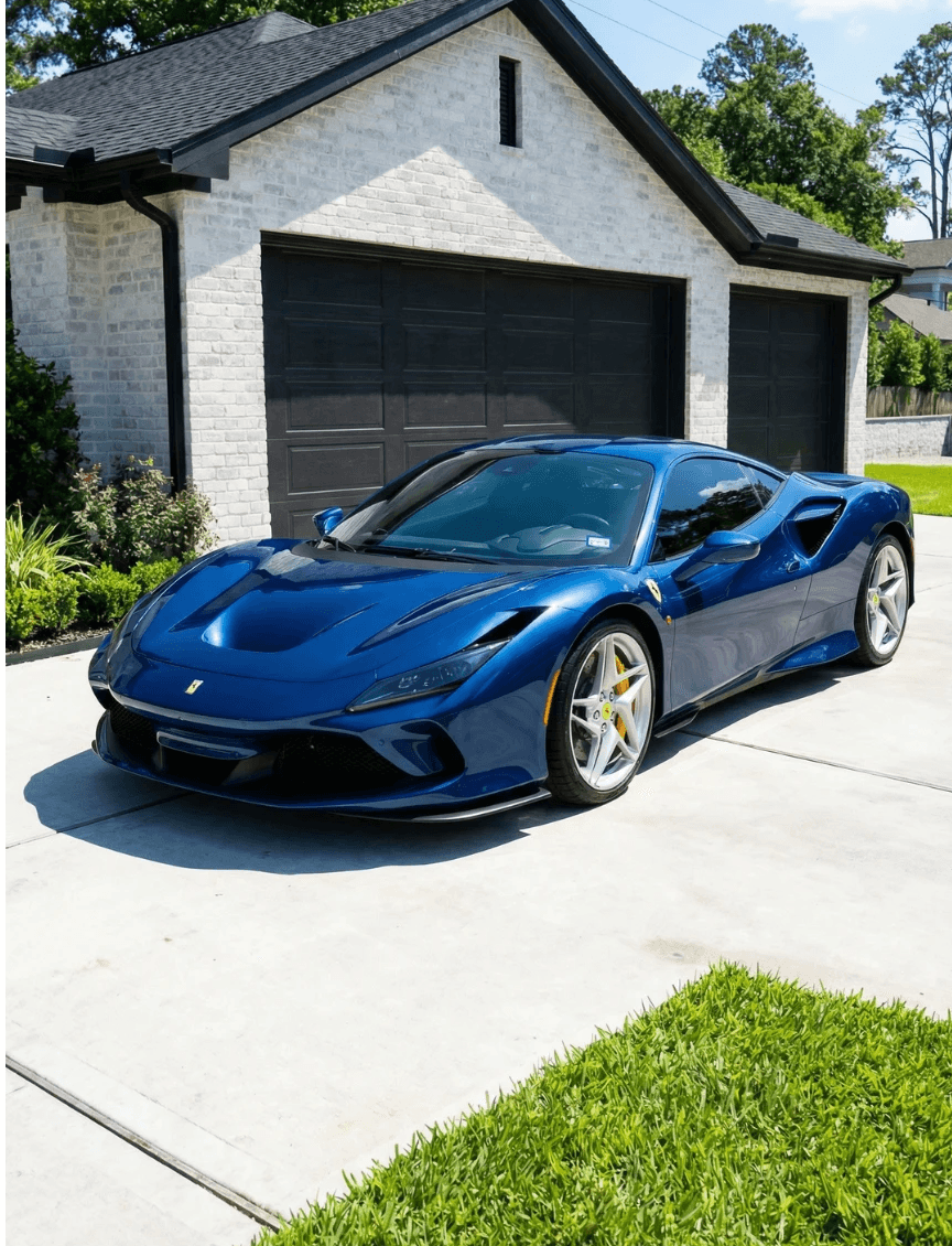 Close-up of a professional detailer in Houston using a dual-action orbital polisher for paint correction and scratch removal on a black luxury car.