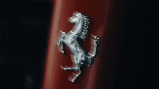 A Ferrari logo on a car part