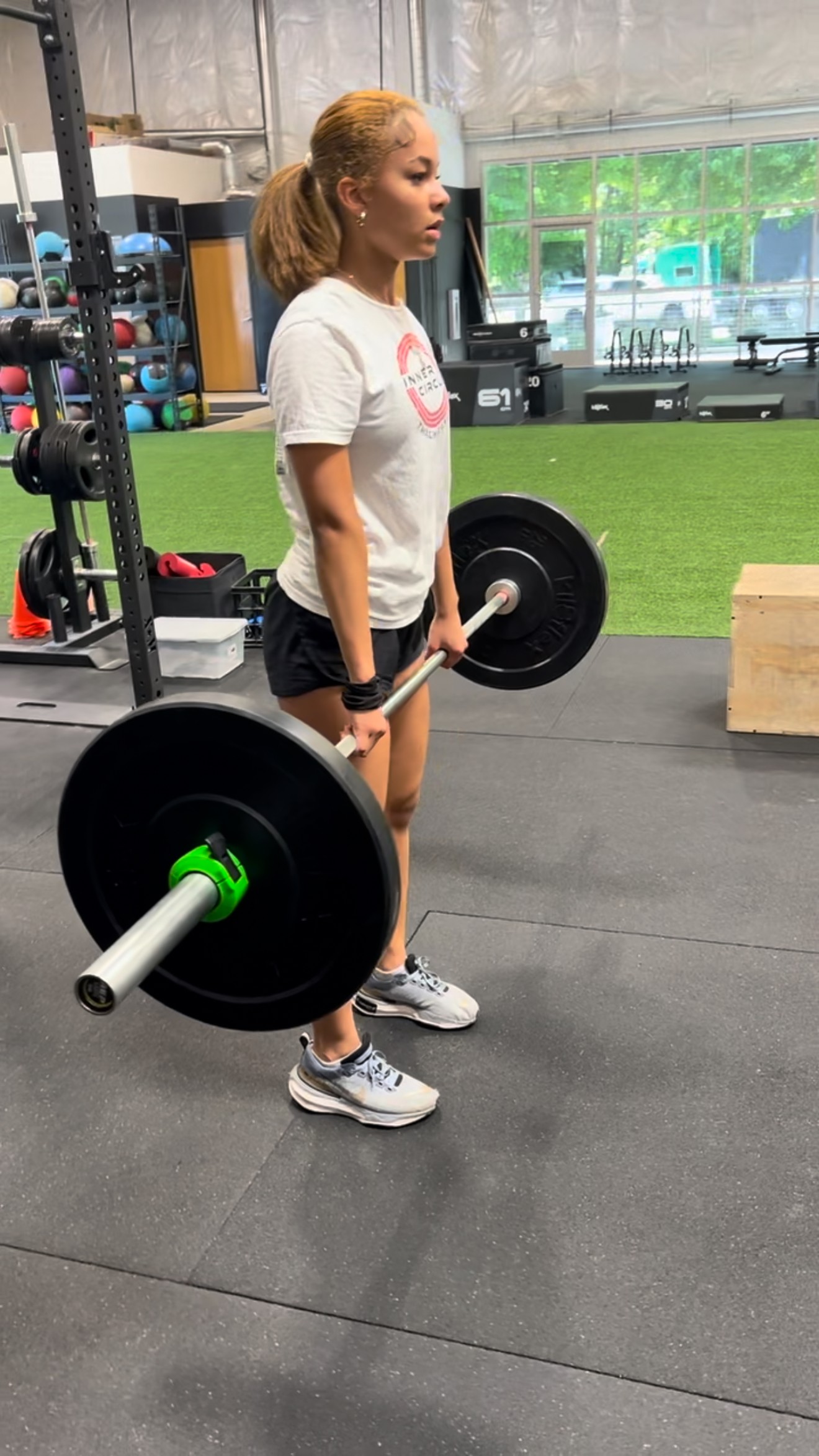 person using a barbell to regain strength as a result of a sporting injury