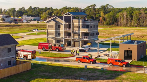 An orange cube-shaped side table is shown.