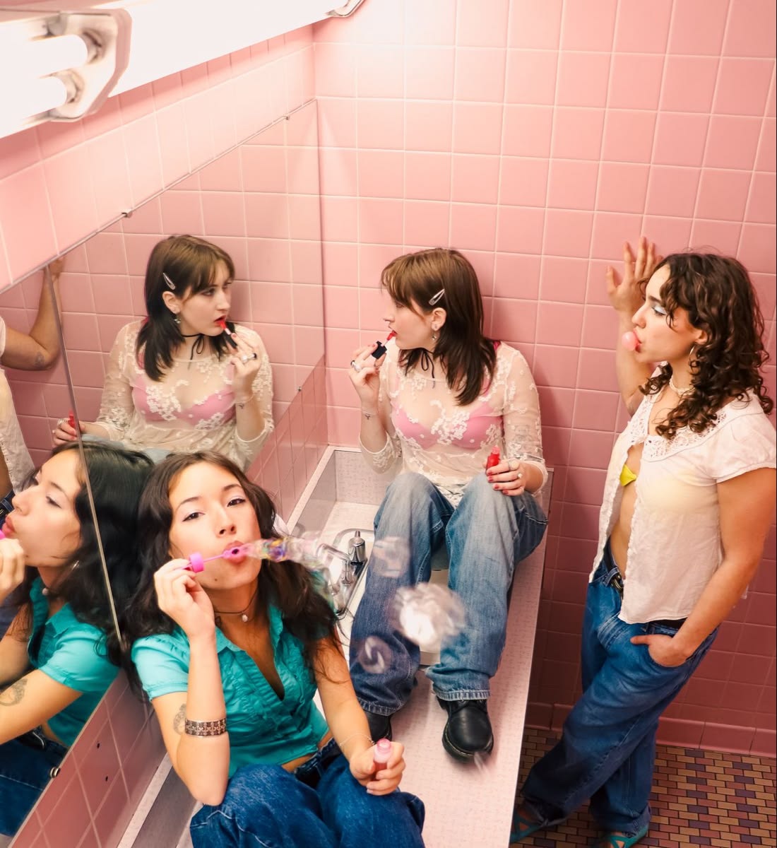 Silhouetted crowd observes pyramid through large windows.