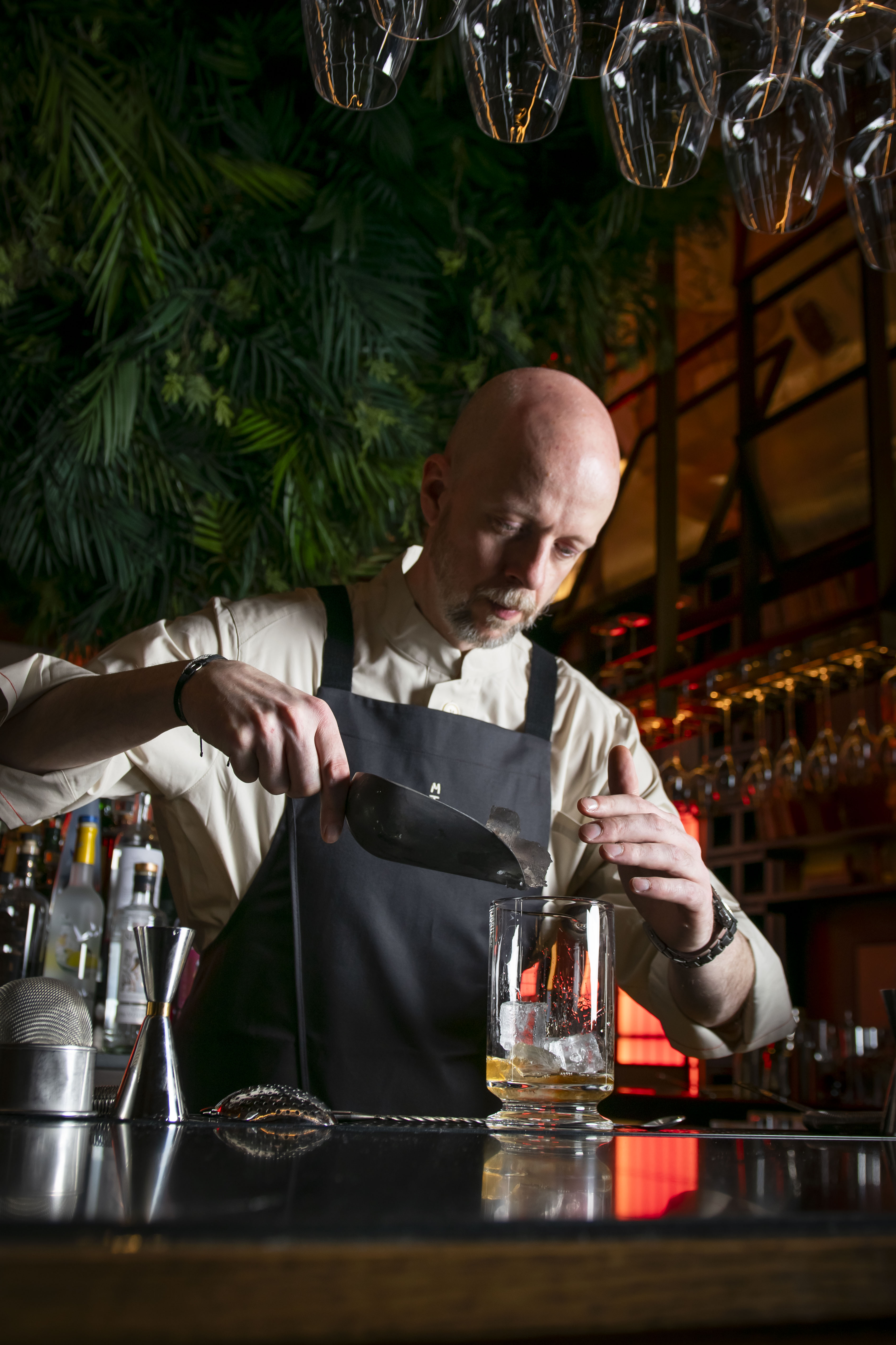 Bartender pouring ice at Mitsu bar