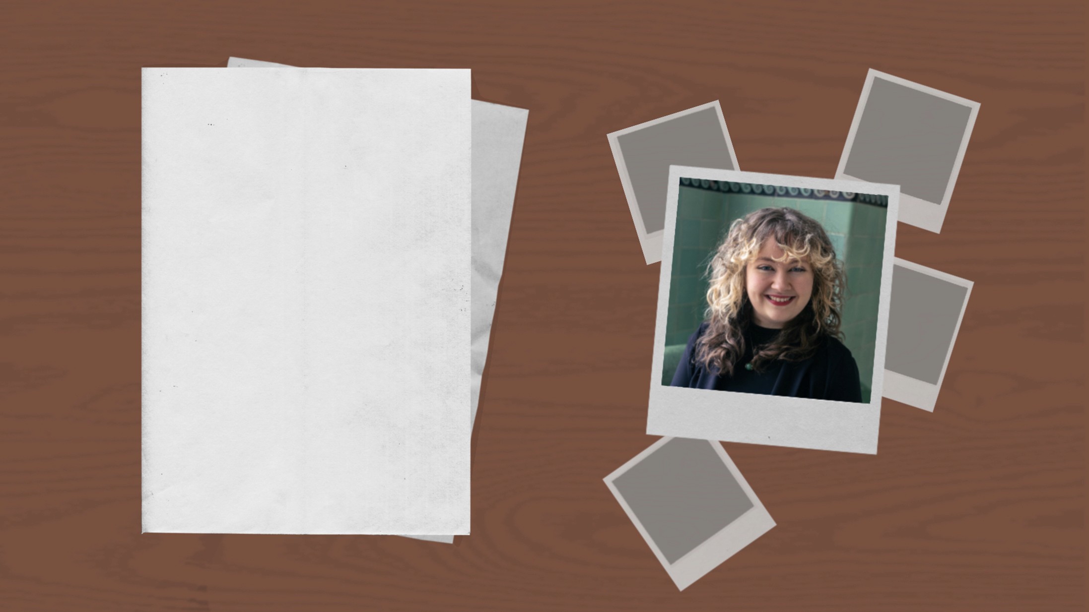 A stack of blank papers and four instant poloriods, one showing a woman with curly hair smiling, on a wooden surface.