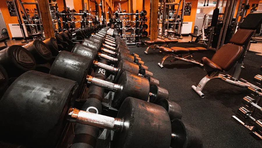 Suburban house with a two-car garage at twilight after a rain shower.