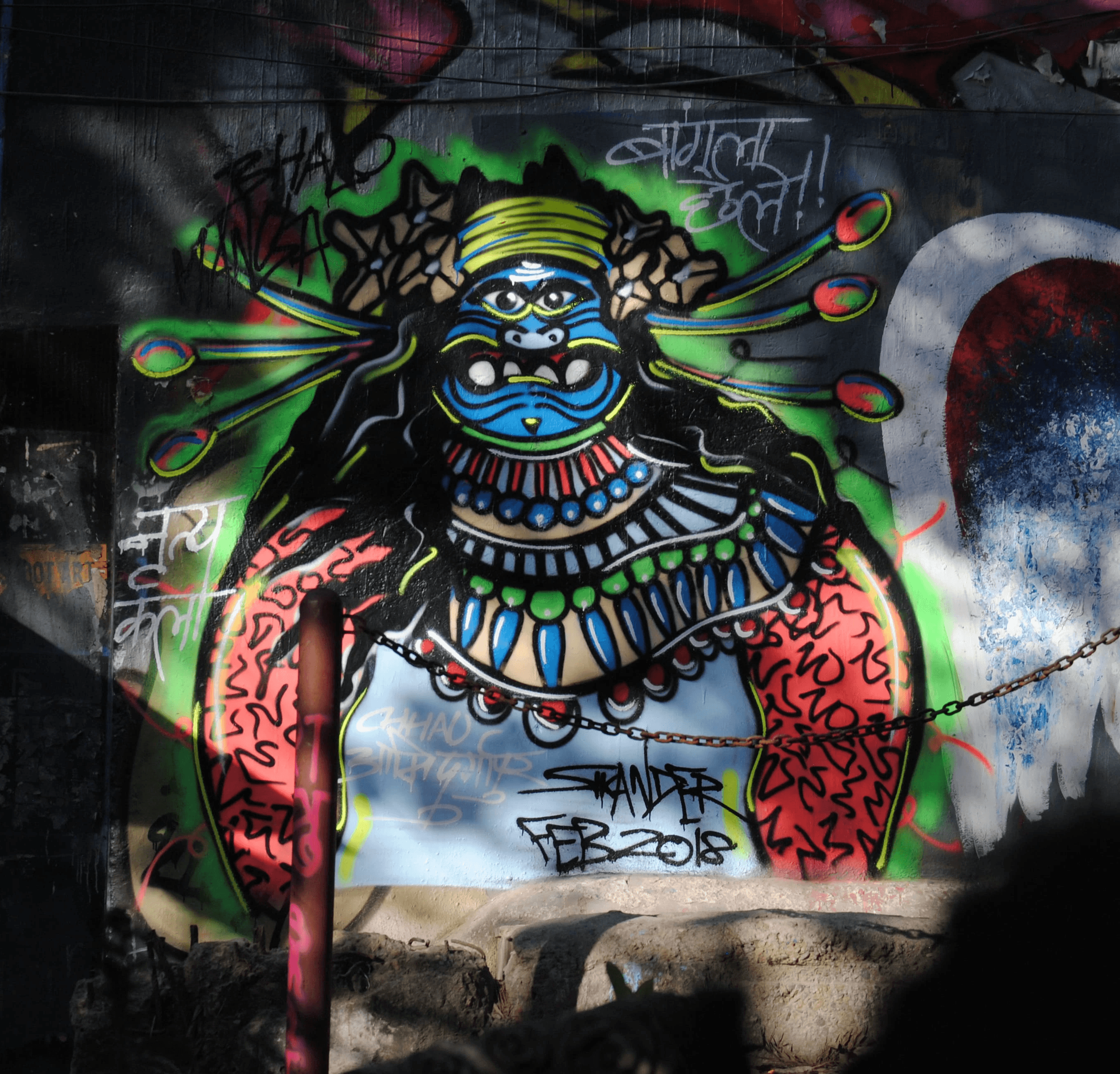 Street graffiti of a Chhau dancer at Hauz Khas Village.