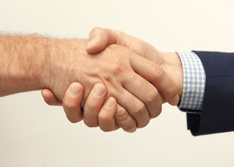 hands holding jigsaw pieces