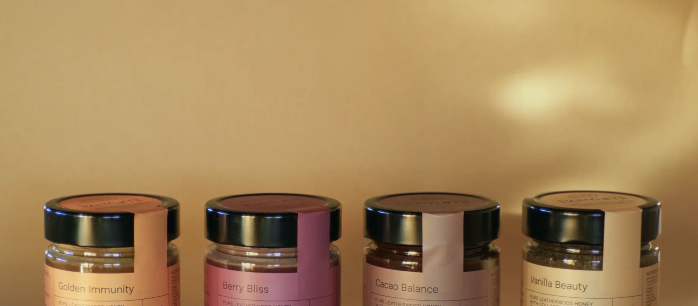 A woman with white blouse hugging jars of gummy