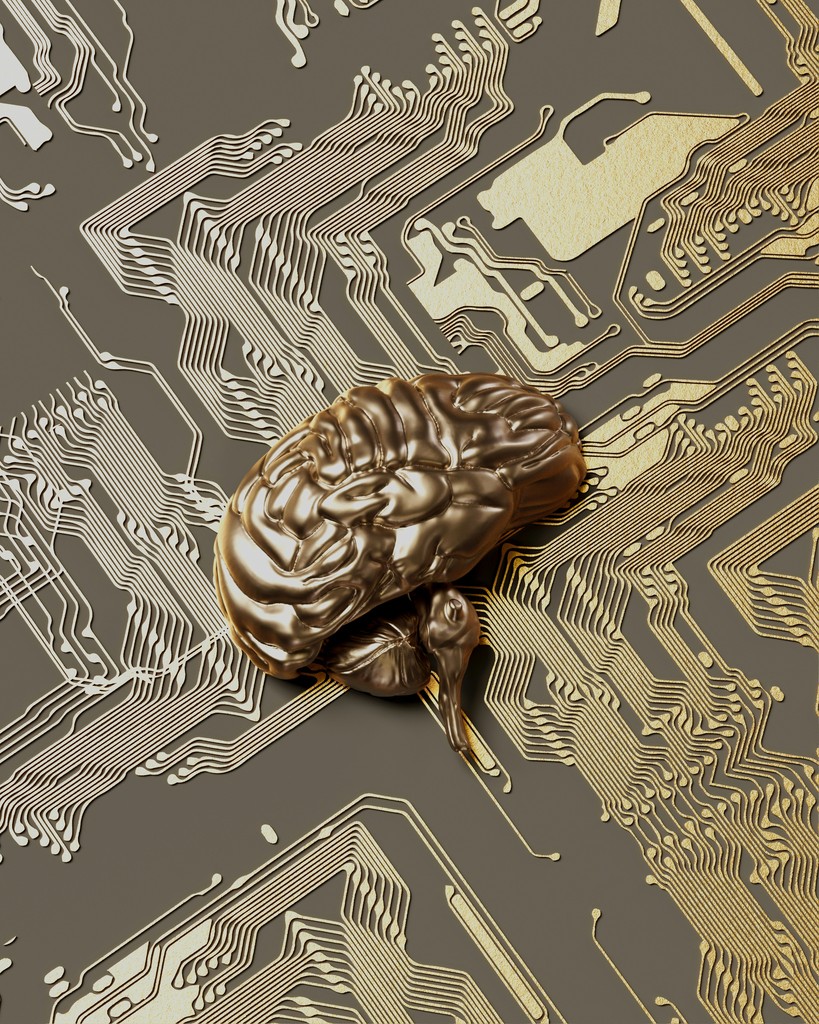 A metallic, gold-colored brain resting on a sophisticated gold and black circuit board, symbolizing the intersection of human intelligence and advanced technology in the realm of artificial intelligence.