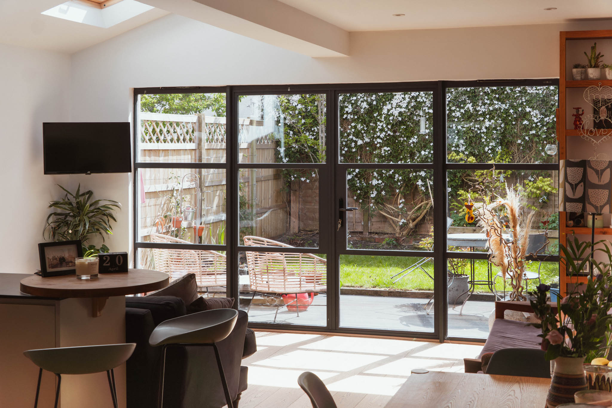 Open plan kitchen dining living room with full-width crittall glazing and garden connection, architect-designed side return extension Bristol
