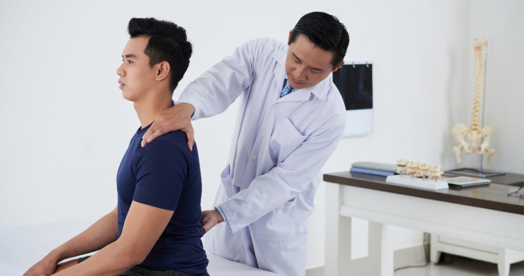 Chiropractor examining a patient in a clinic setting