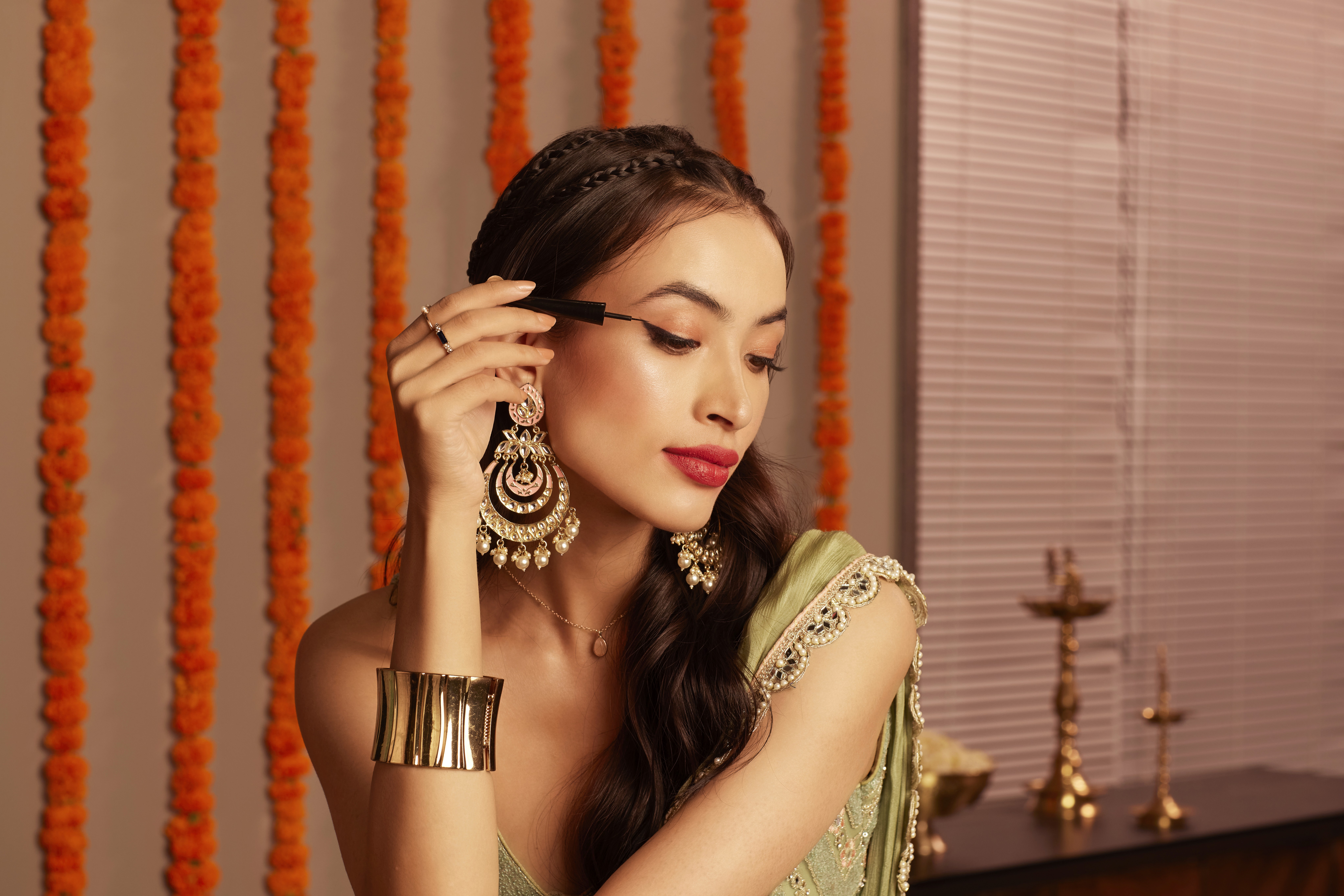 Group of friends smiling on a lively city street at night