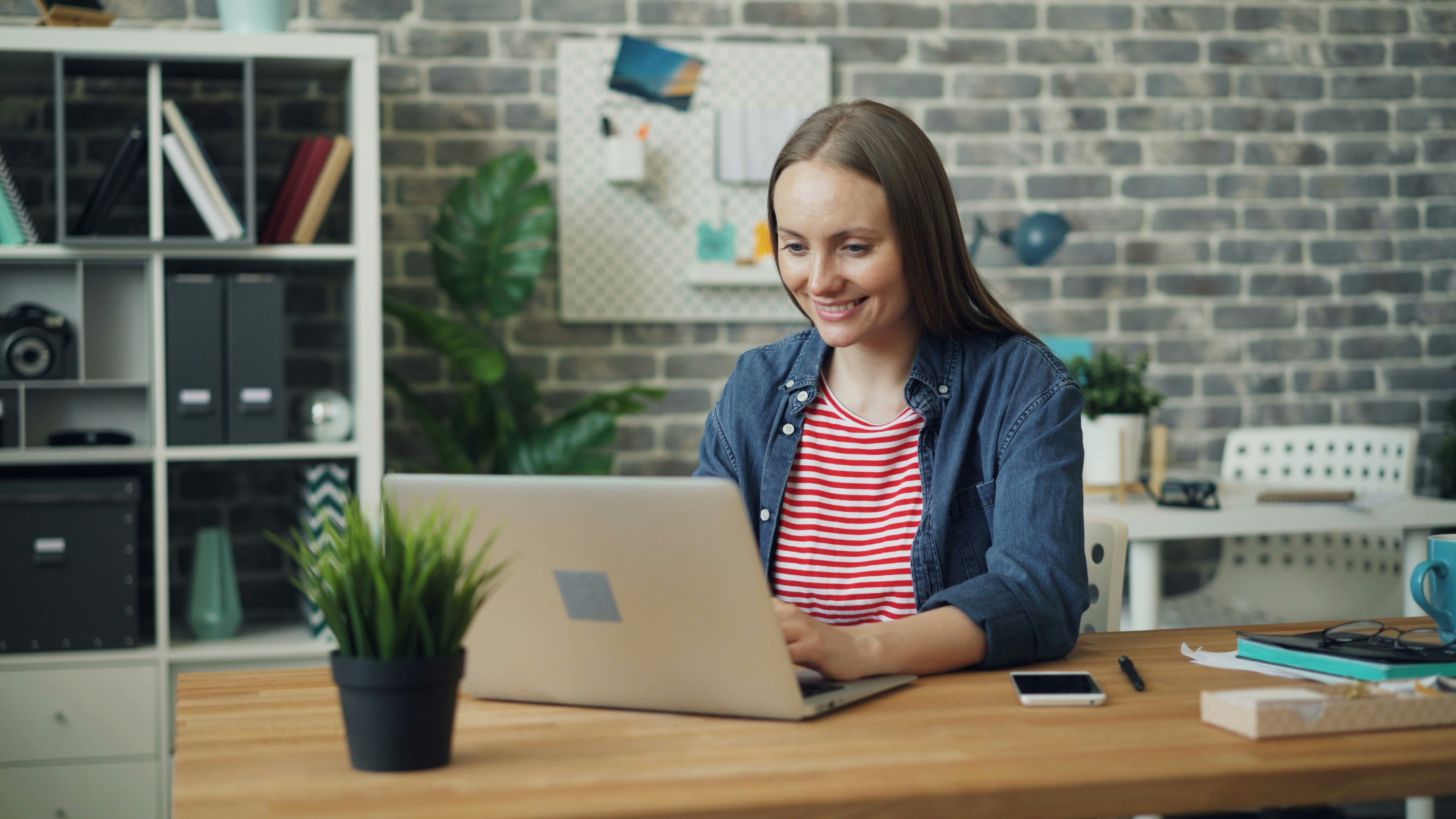 woman happy to use Jasper AI Alternative