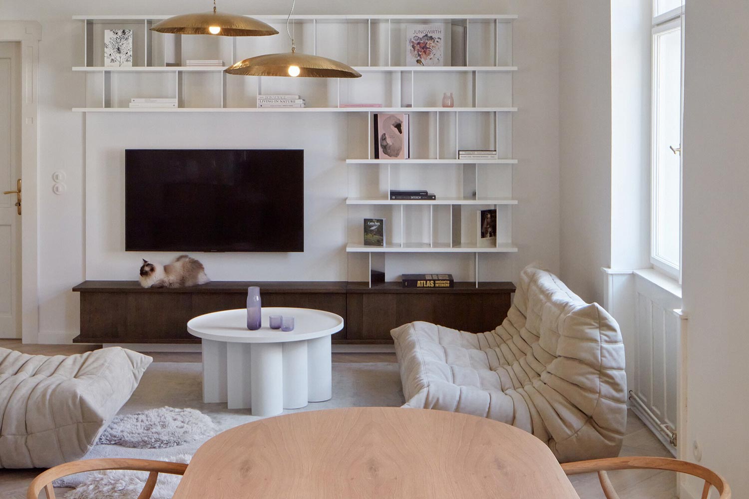 Stella table placed in interior highlighting architectural presence and clean geometry by Jiri Krejcirik