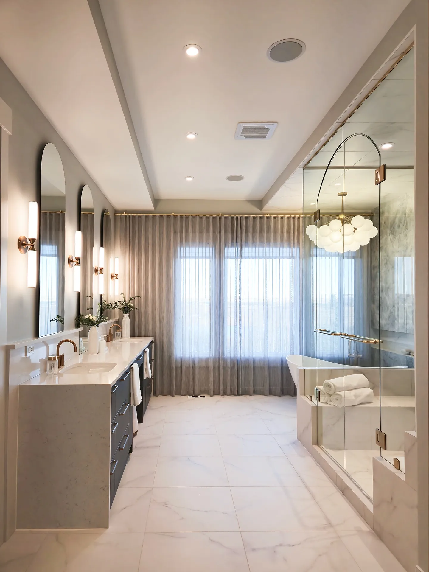 Image of large ensuite with natural light and luxurious features.