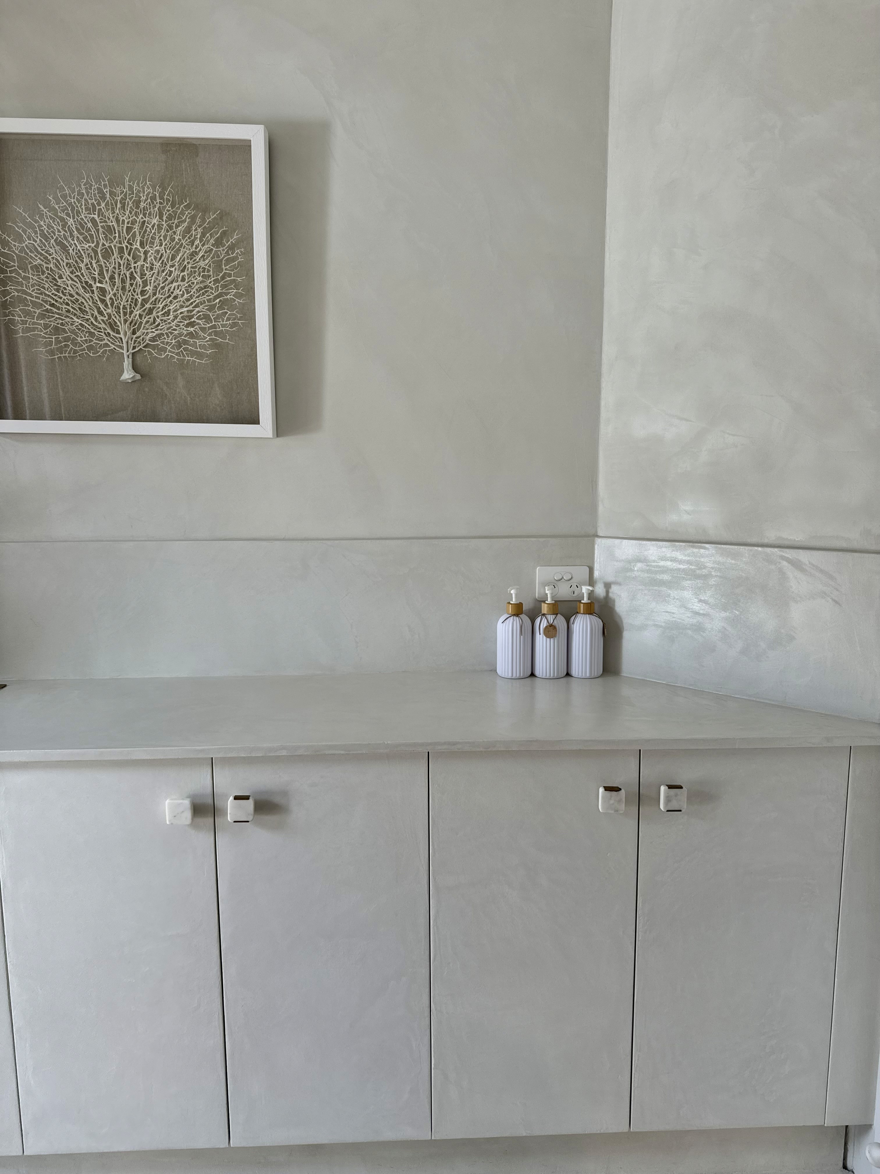 Refined interior passage in monochrome mineral finishes