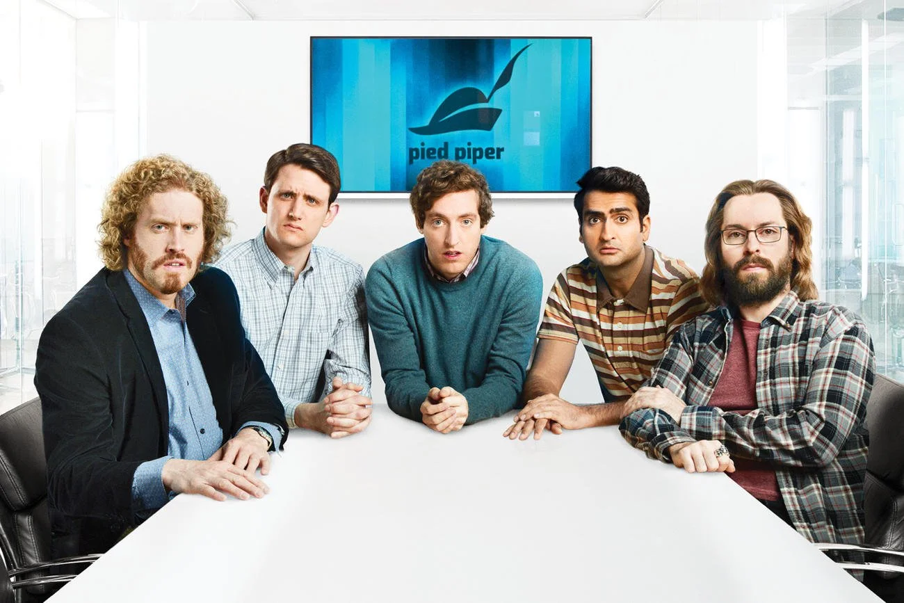 Cast Photo of Silicon Valley at desk