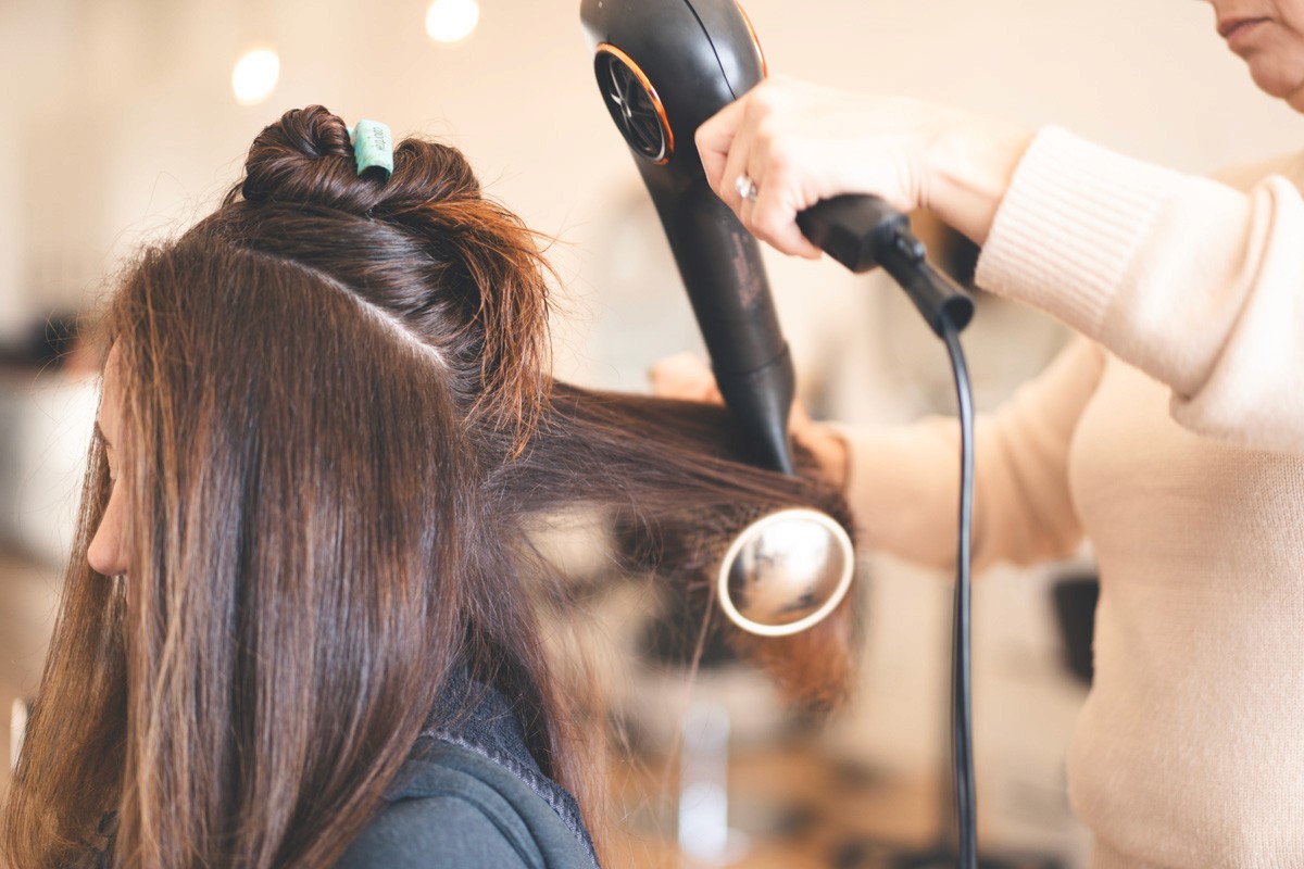 Blowout service in progress at Del Sol Hair Studio, Huntington Beach