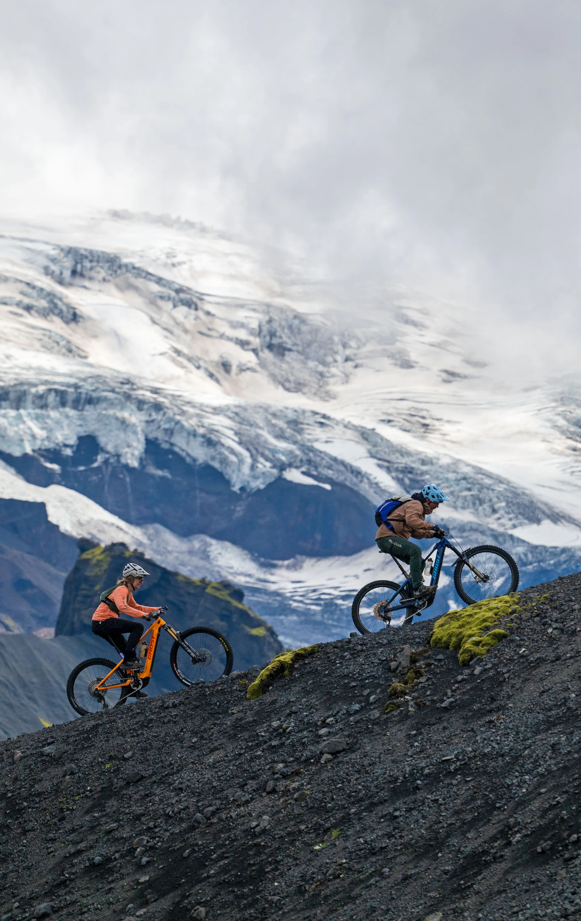 Bike riders with glacier in backround