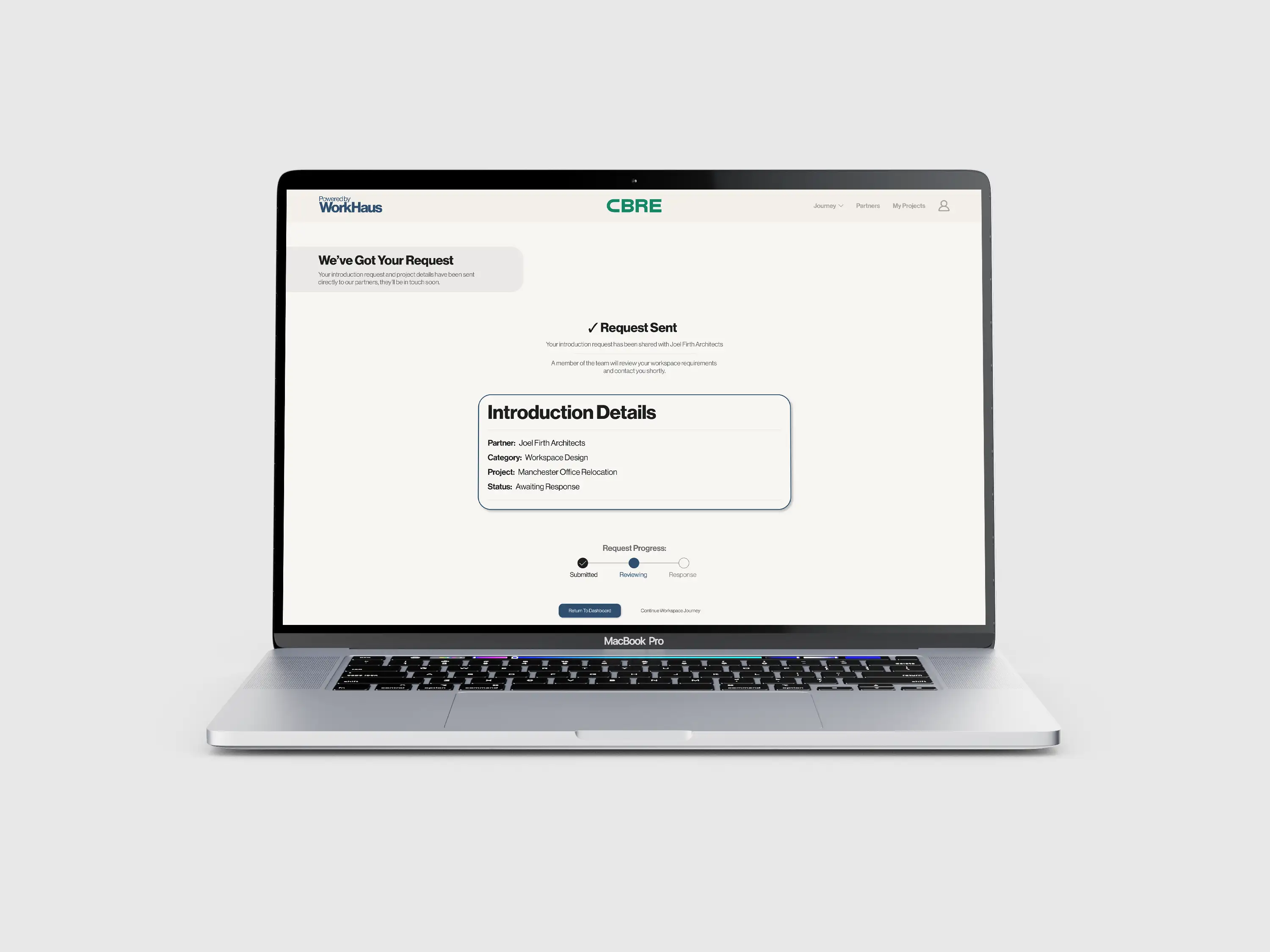 WorkHaus prototype displayed on a laptop, showing a project enquiry and introduction form.