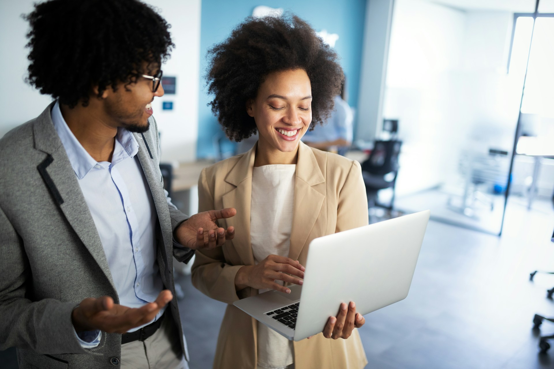 Two person standing while talking to each other